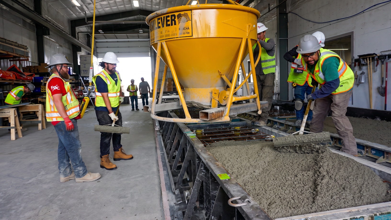 Peaks Precast concrete pour and spread process inside manufacturing facility, Buena Vista Colorado
